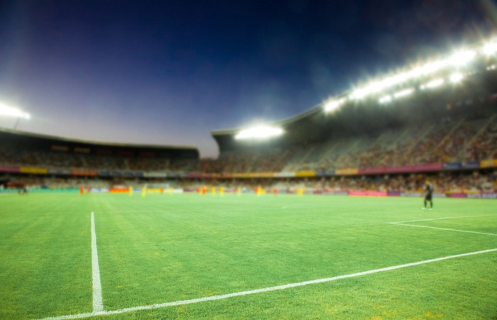 Blurred Football Stadium in the Evening