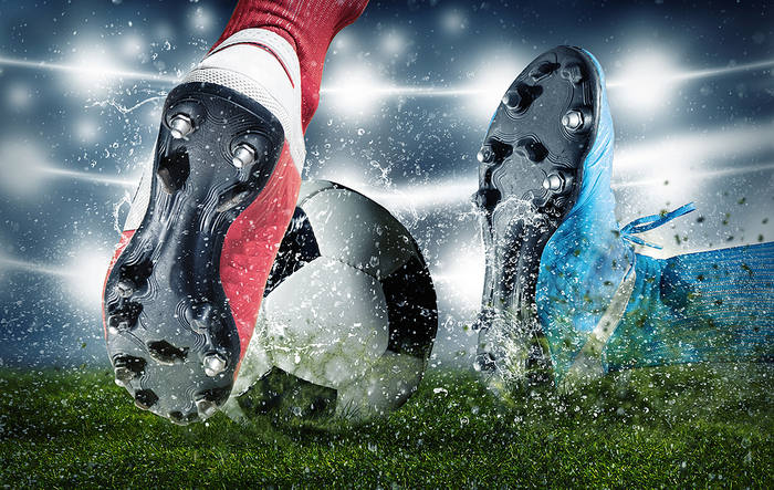 Red and Blue Football Boots in Tackle