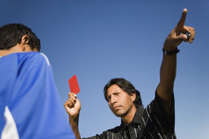 Referee giving red card