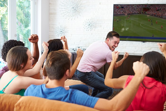 Group of Friends Celebrating Watching Football