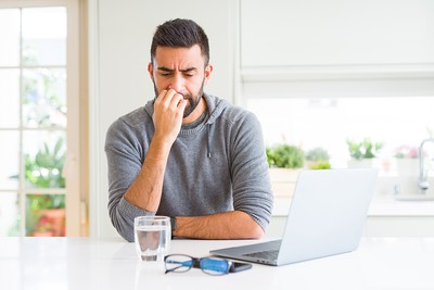 Worried Looking Man with Laptop