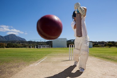 Cricket Batsman Playing Shot Down Wicket