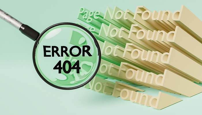 Page Not Found with 404 Error Message Under Magnifying Glass