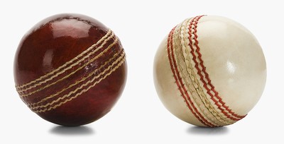 Red and White Cricket Balls Close Up