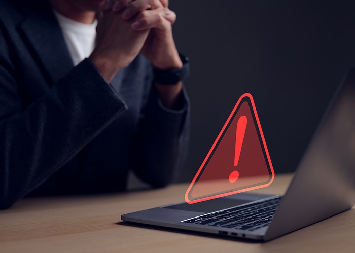 Warning Triangle In Front of Laptop