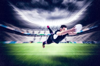 Blurred Rugby Player Diving to Score Try