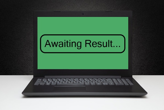 Awaiting Result Message on Laptop Screen